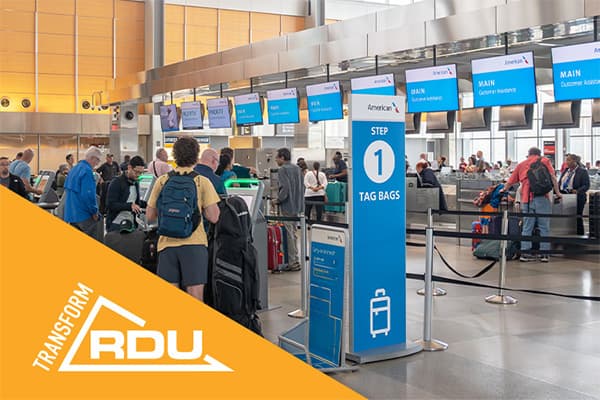 Airport check-in area with passengers queuing at counters, blue signage showing Step 1 Tag Bags, and RDU branding visible.