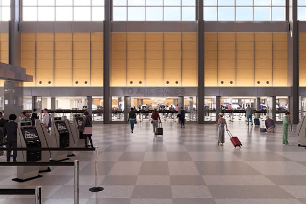 Modern airport terminal interior with large windows, travelers with luggage walking through spacious hall with tiled floor.